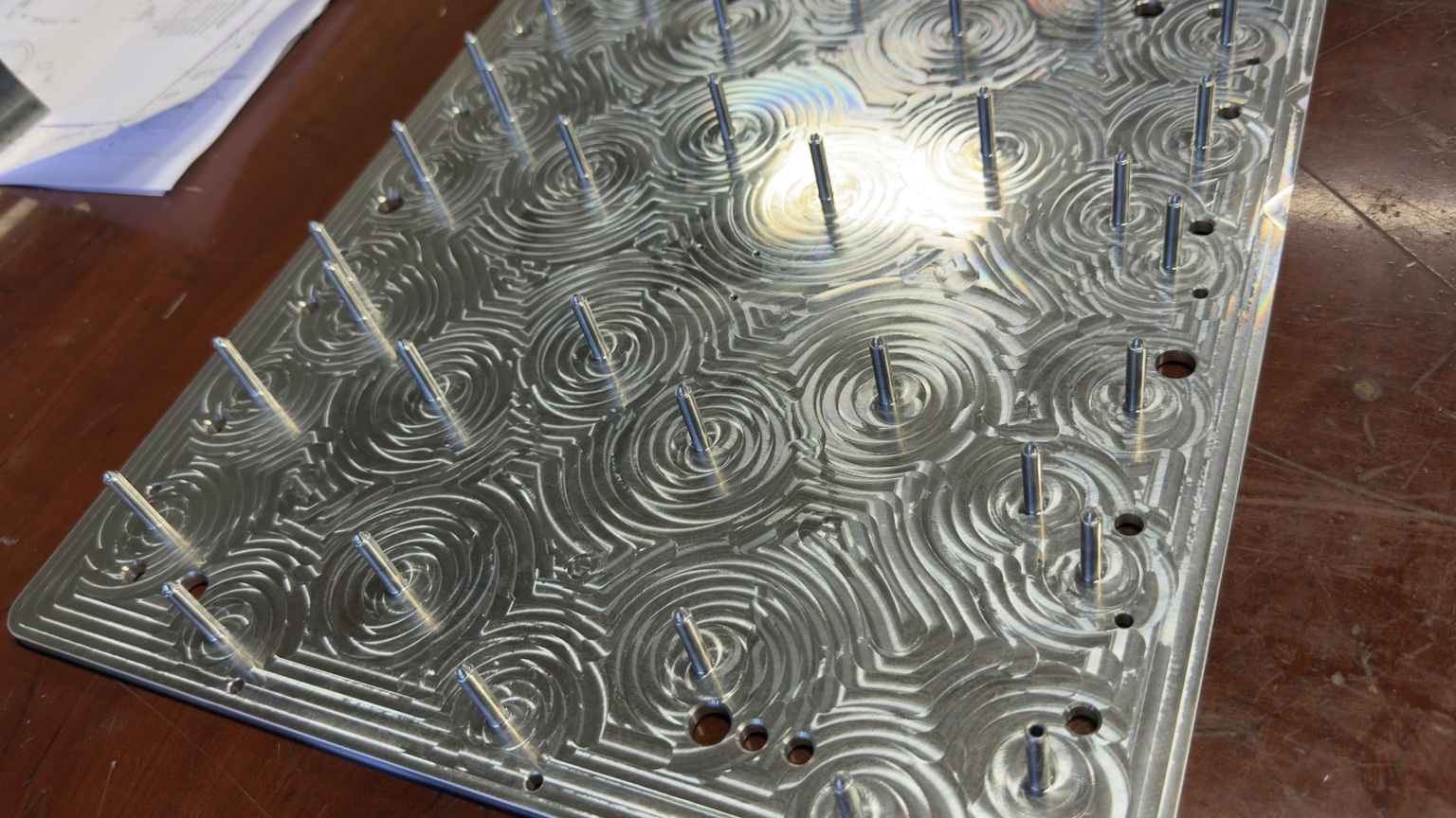 Machined aluminum production fixture with multiple locating pins